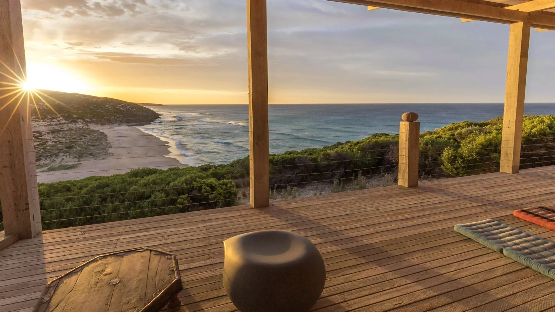 Off-grid shelter with wooden deck and ocean view in solitude